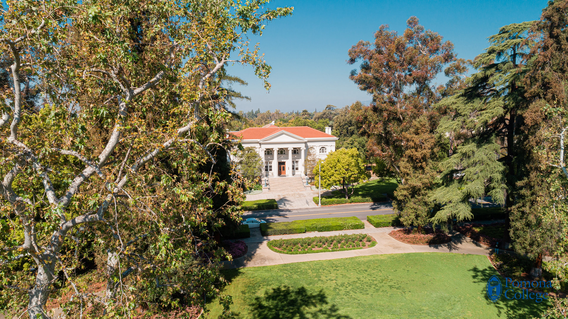 Pomona College campus with historic Bridges Hall framed by trees