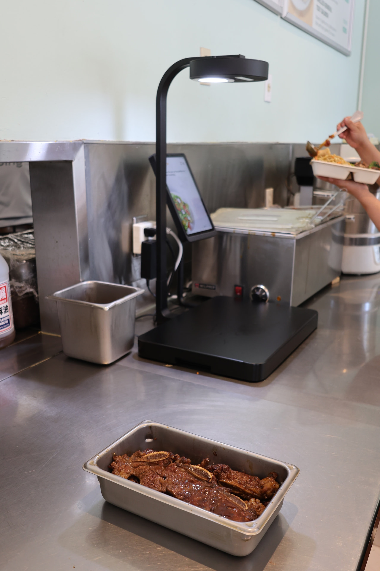 A prepared dish next to the Metafoodx scanner on the Eaping serving line